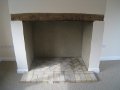 Original fireplace with Bressumer and new hearth, using re-claimed bricks