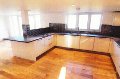 Contemporary new kitchen with solid oak floor